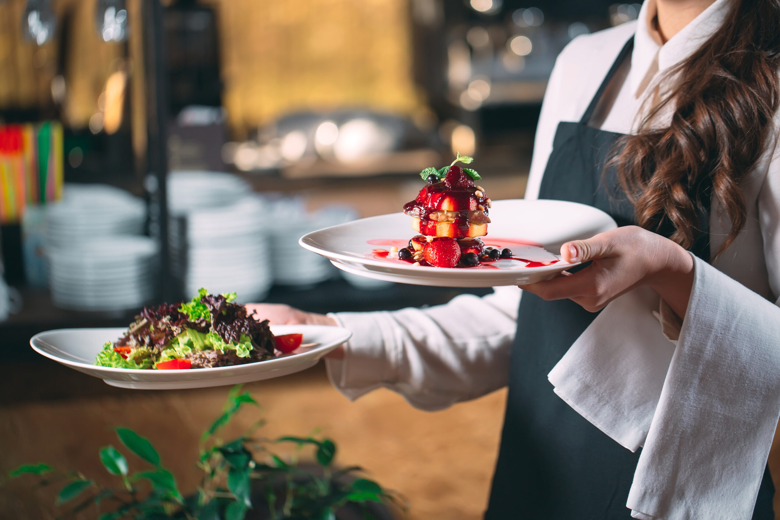 waiter serving in motion on duty in restaurant. the waiter carri